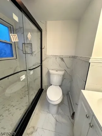 a bathroom with a sink a mirror and vanity