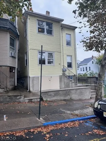 a view of a house with a street