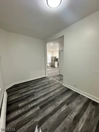 a view of a livingroom with wooden floor