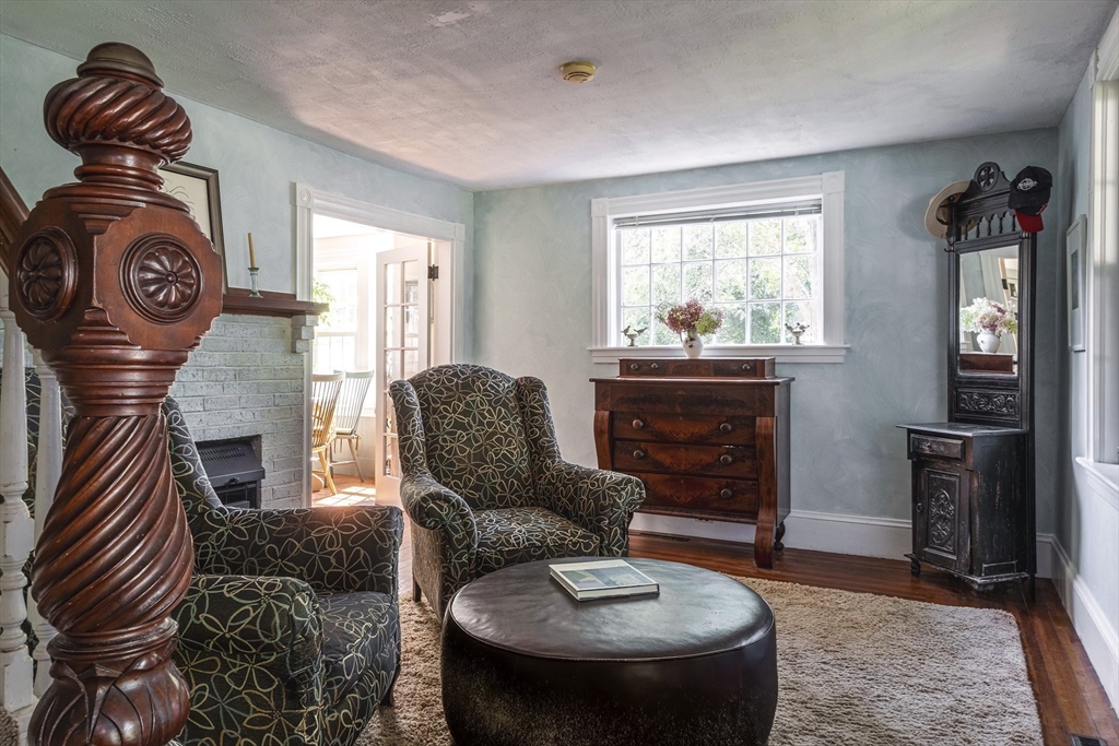 51 Turkey Shore Road Ipswich, MA 01938 - Photo 12 of 23 a living room with furniture a fireplace and a window