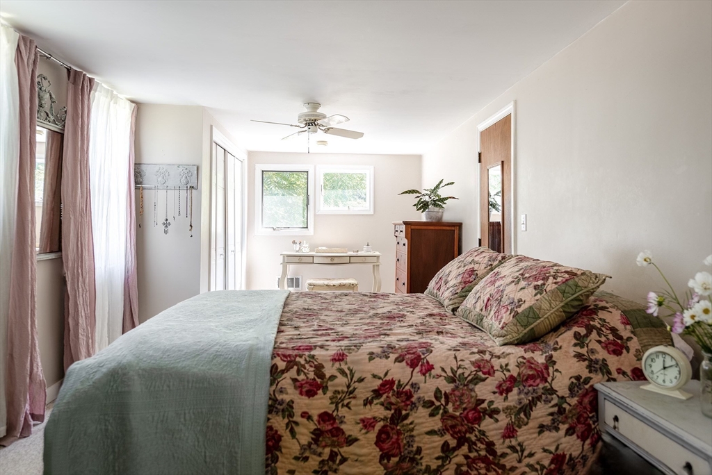51 Turkey Shore Road Ipswich, MA 01938 - Photo 15 of 23 a bedroom with a large bed and a window