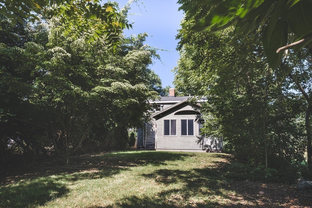 51 Turkey Shore Road Ipswich, MA 01938 - Photo 21 of 23 a front view of a house with a garden