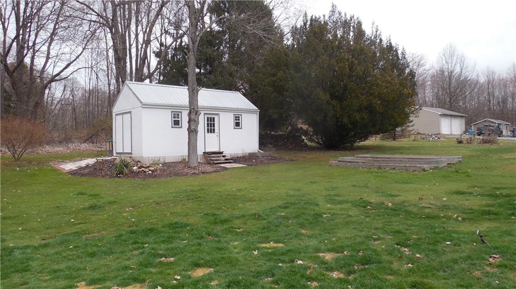2110 Pulaski Road New Castle, PA 16105 - Photo 22 of 25 Outbuilding currently used as a workshop (Tiered garden area off to the right)