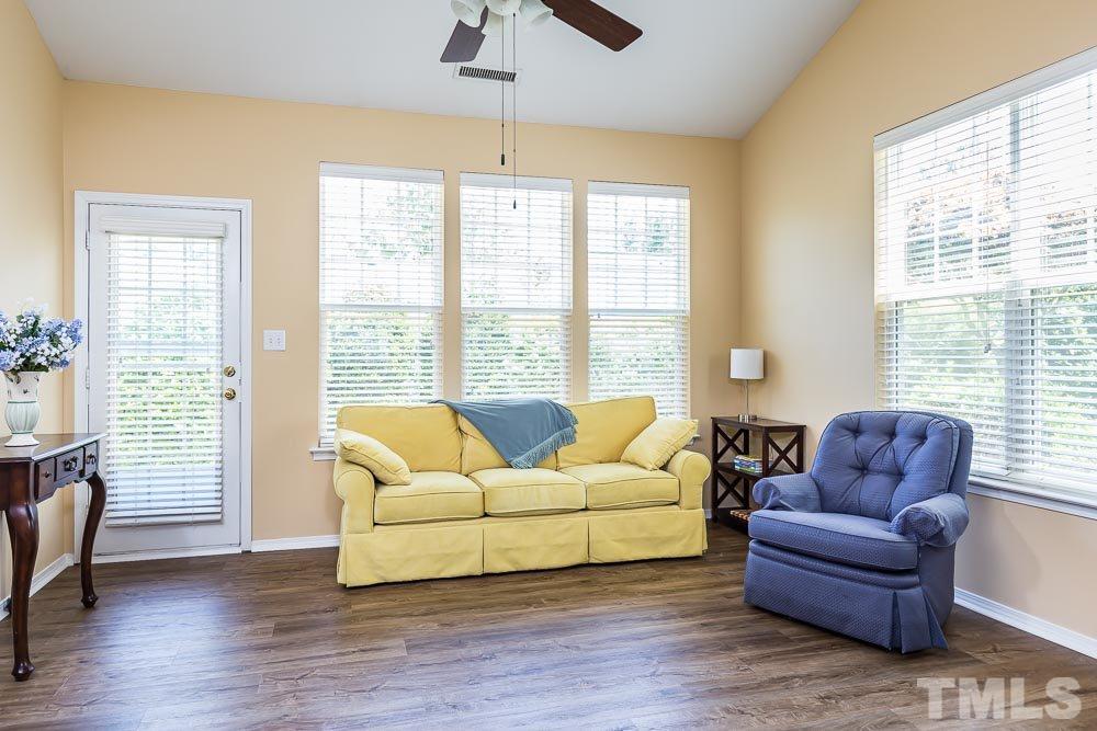 8308 Chimneycap Drive Raleigh, NC 27613 - Photo 8 of 23 Soaring ceilings and abundant windows lend a sense of expansiveness and airiness.