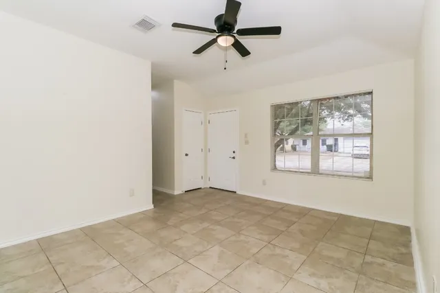 a view of an empty room with a window