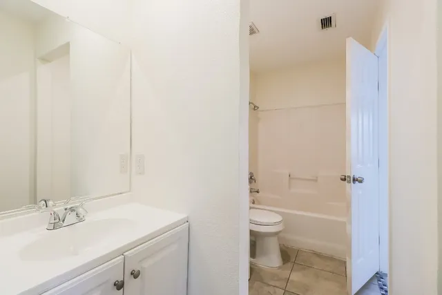 an empty room with fan