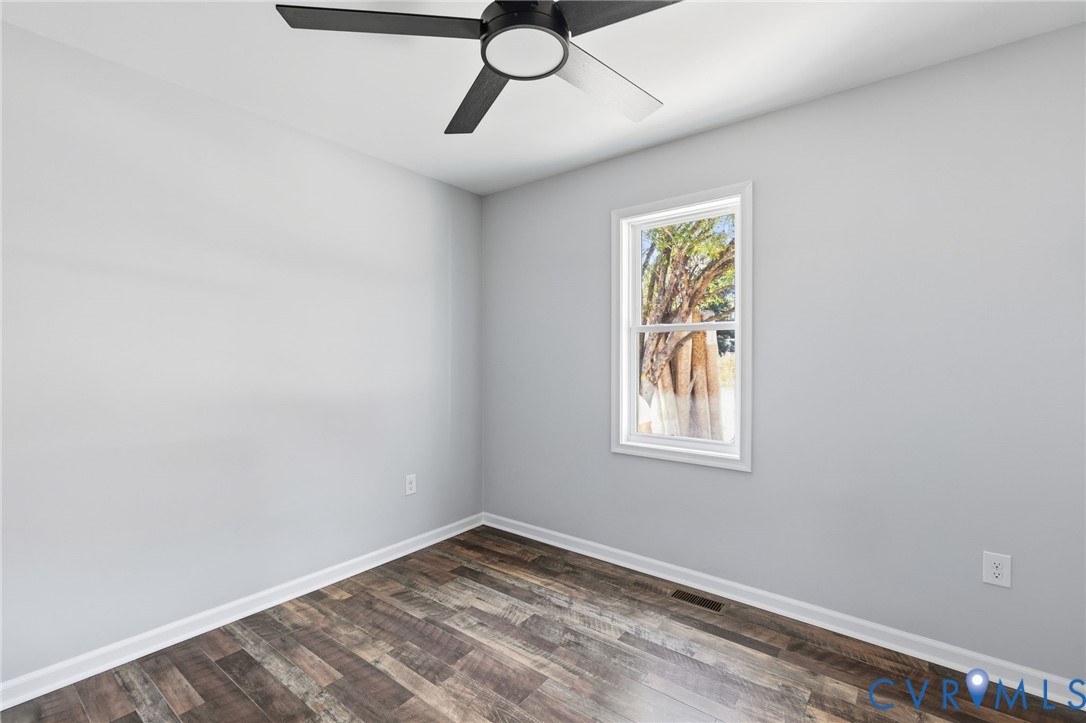 310 Stratton Street Crewe, VA 23930 - Photo 10 of 25 a view of an empty room with window and chandelier fan