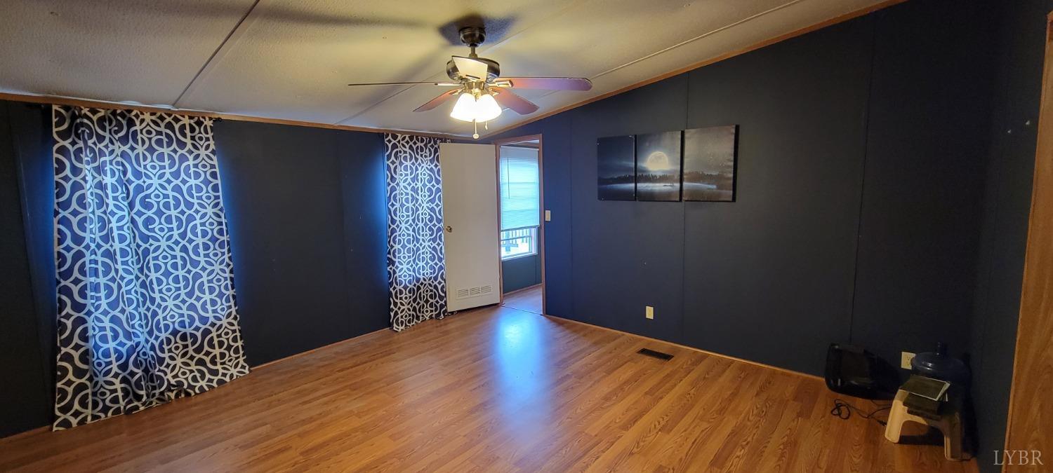 1015 Spring Mill Road Concord, VA 24538 - Photo 11 of 54 a view of an empty room with window and wooden floor