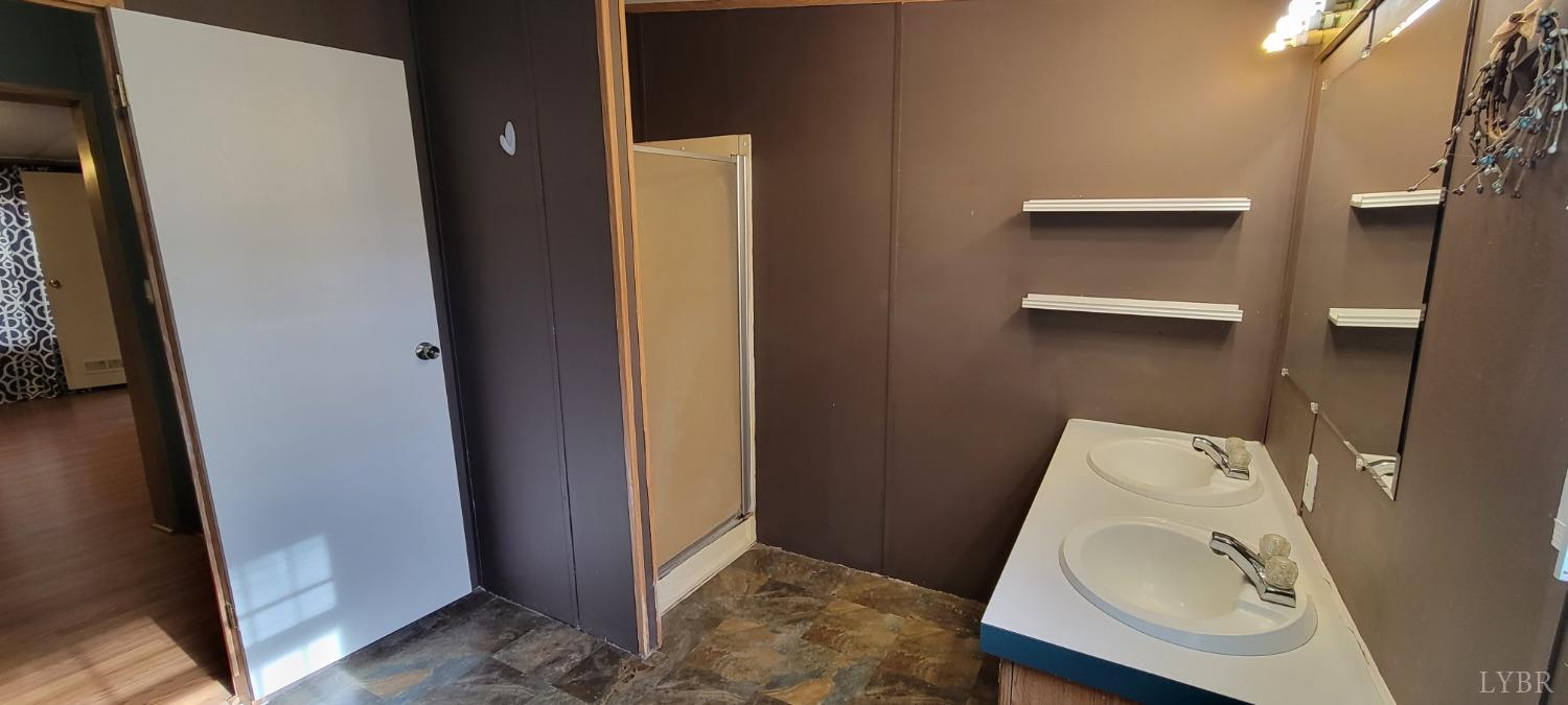 1015 Spring Mill Road Concord, VA 24538 - Photo 18 of 54 a bathroom with a sink and toilet