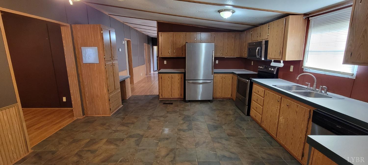 1015 Spring Mill Road Concord, VA 24538 - Photo 24 of 54 a kitchen with refrigerator and sink
