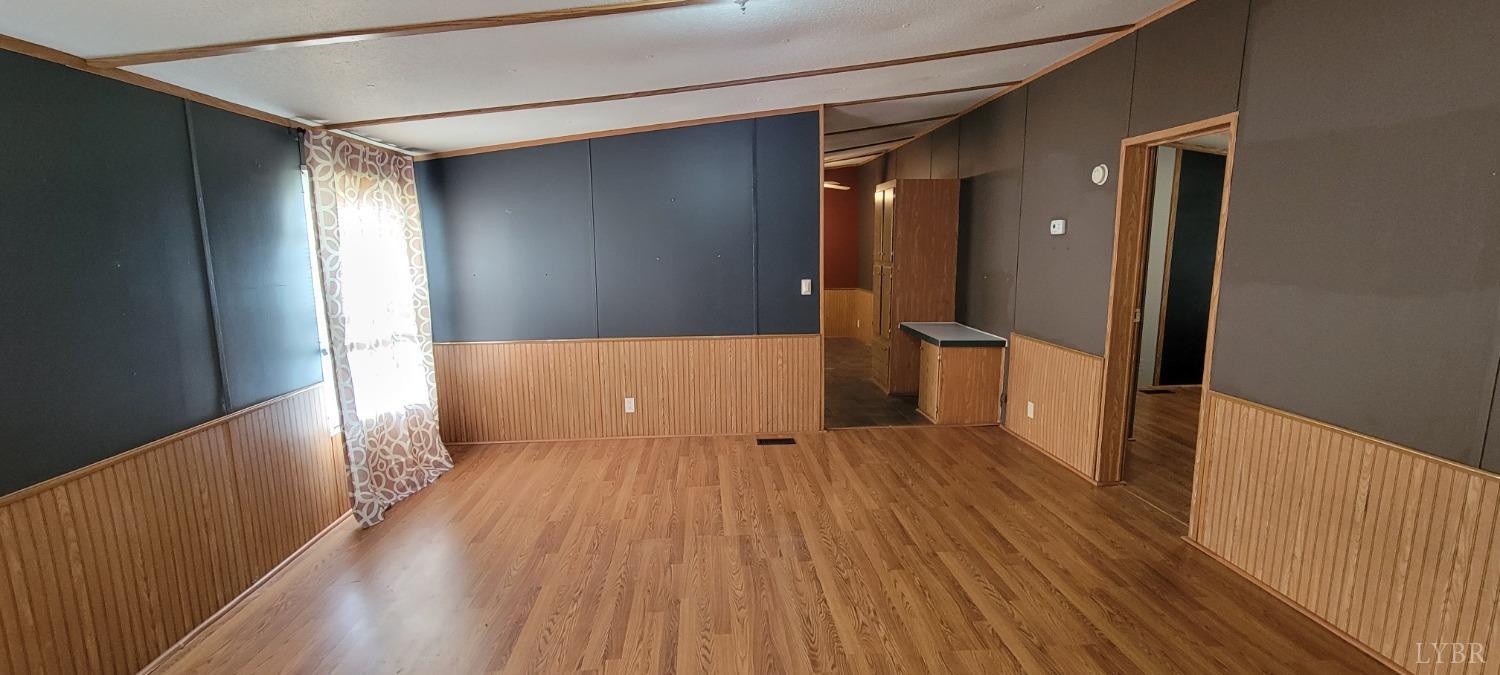 1015 Spring Mill Road Concord, VA 24538 - Photo 31 of 54 wooden floor in an empty room with a window