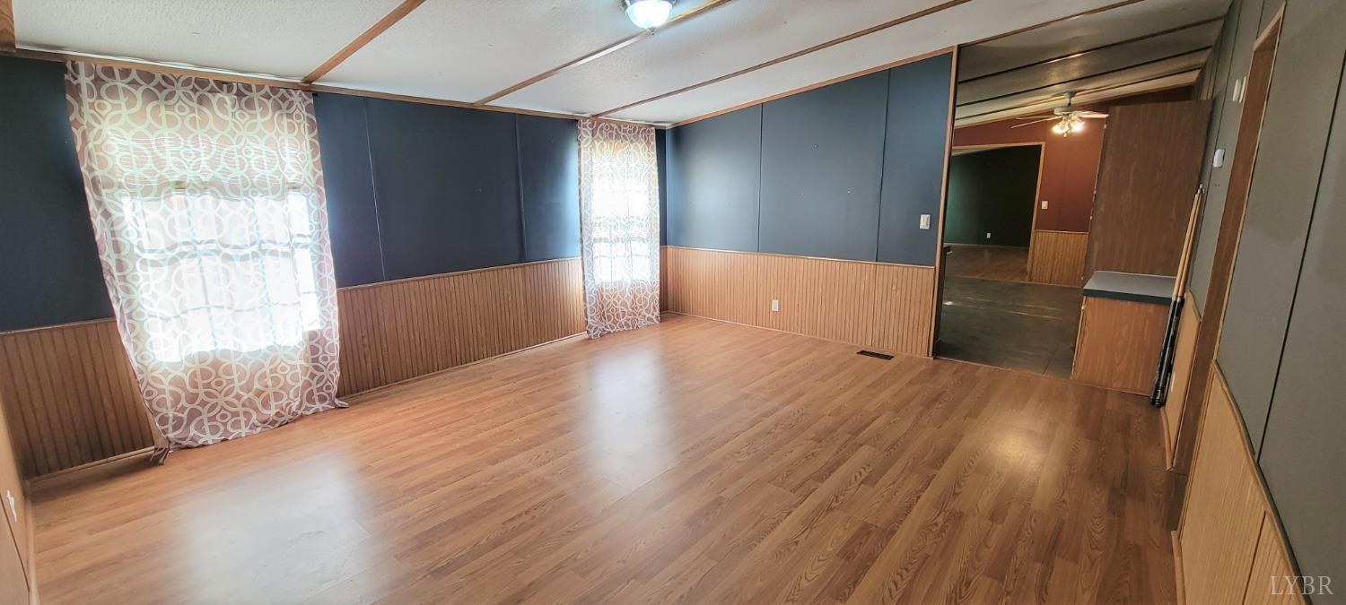 1015 Spring Mill Road Concord, VA 24538 - Photo 36 of 54 wooden floor in an empty room with a window