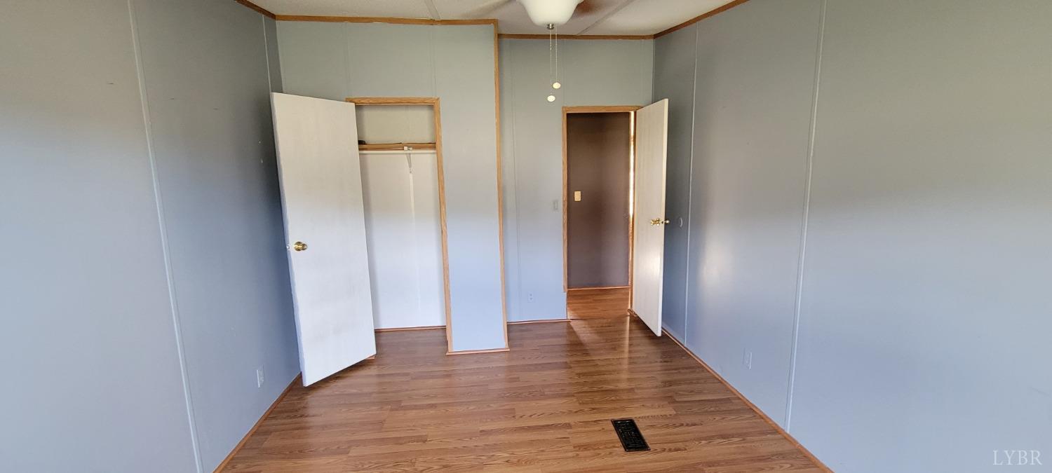 1015 Spring Mill Road Concord, VA 24538 - Photo 38 of 54 a view of a hallway with wooden floor