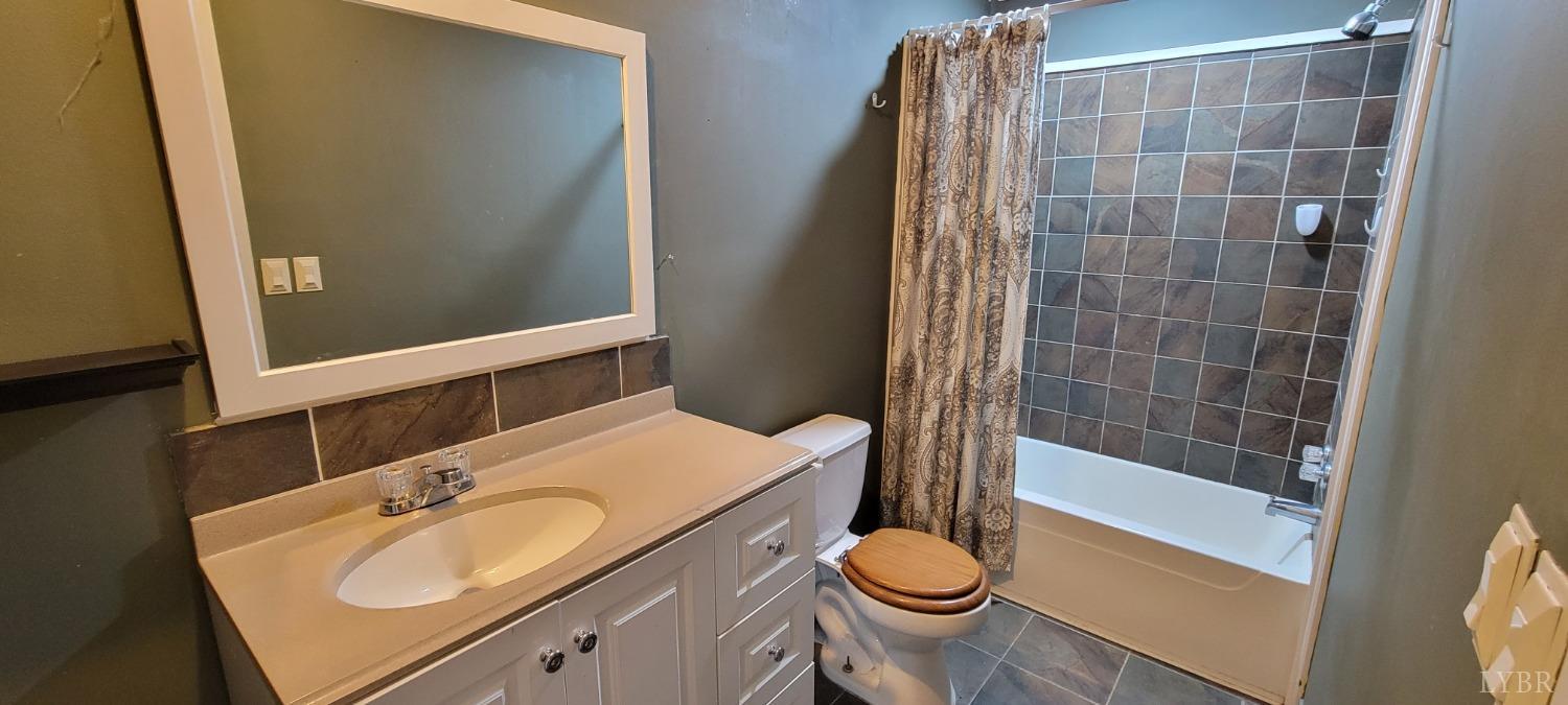 1015 Spring Mill Road Concord, VA 24538 - Photo 39 of 54 a bathroom with a sink and a mirror