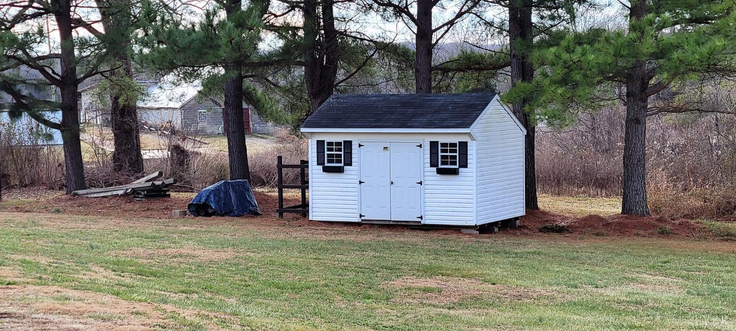1015 Spring Mill Road Concord, VA 24538 - Photo 52 of 54 a view of a small house with yard and trees