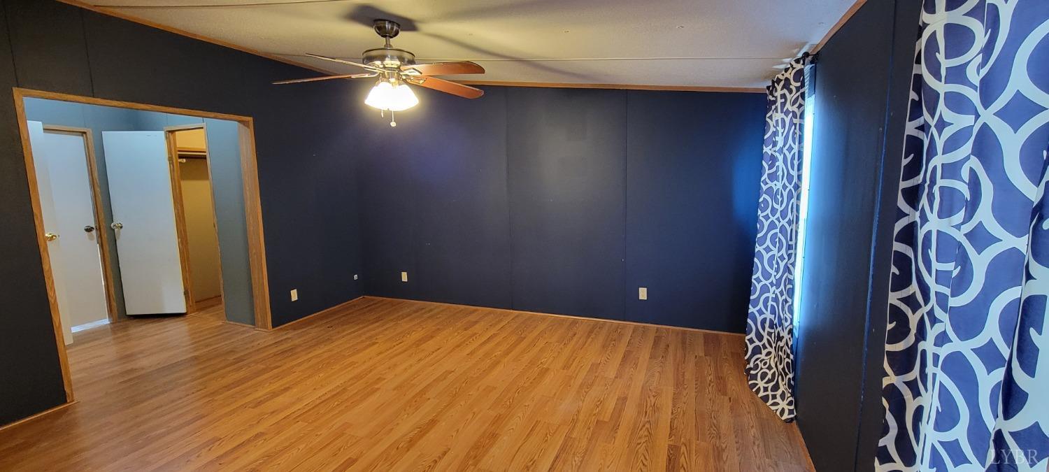 1015 Spring Mill Road Concord, VA 24538 - Photo 9 of 54 wooden floor in an empty room with a window