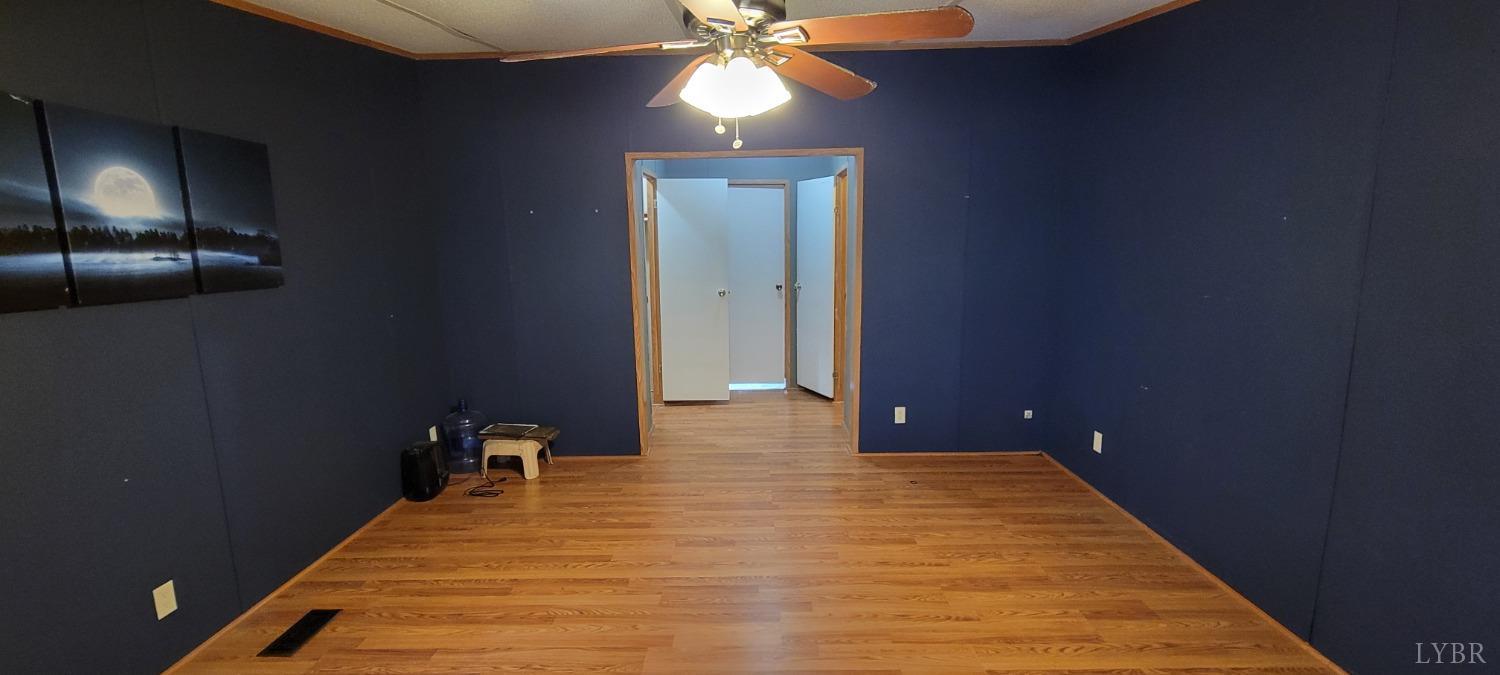 1015 Spring Mill Road Concord, VA 24538 - Photo 10 of 54 a bedroom with a bed and a chandelier