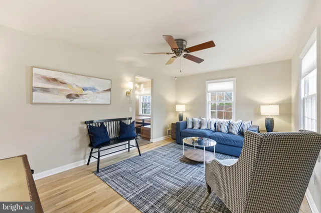 a living room with furniture rug and window
