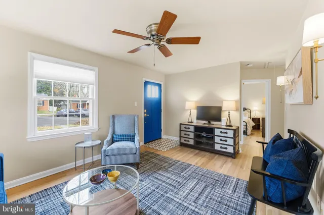 a kitchen with stainless steel appliances granite countertop a refrigerator a stove top oven a sink dishwasher and wooden cabinets