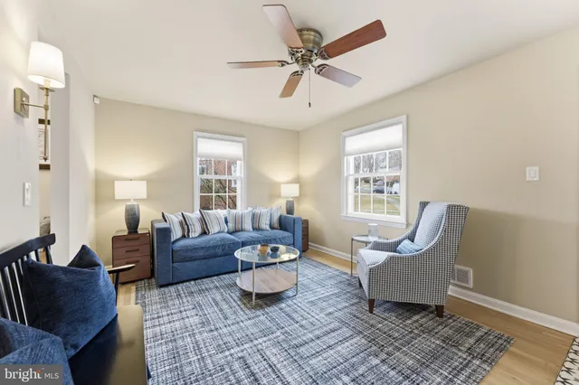 a kitchen with a table chairs and microwave
