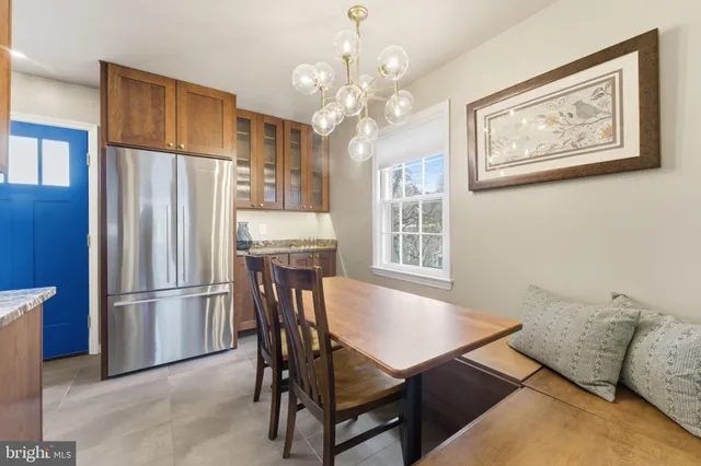 a kitchen with stainless steel appliances granite countertop a stove sink and cabinets