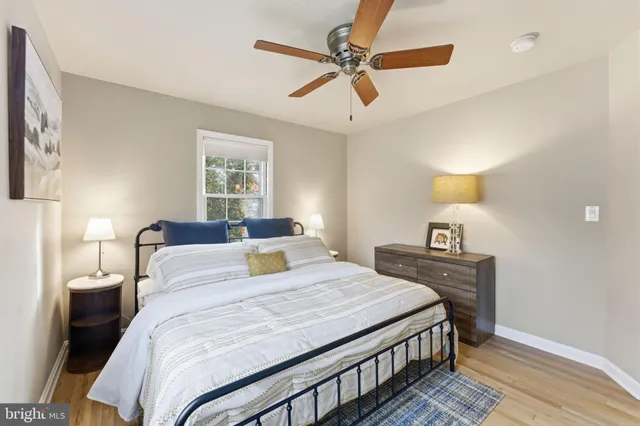 a bedroom with a bed furniture and a window