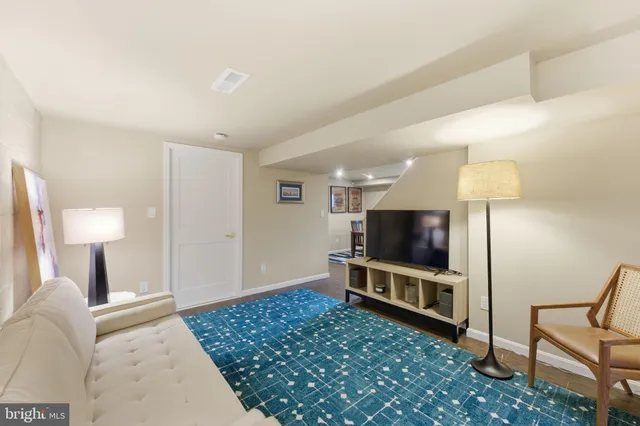 a bathroom with a toilet a sink and a mirror