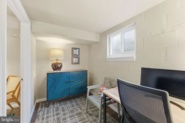 a bedroom with a bed and a table in it