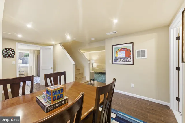 a bedroom with furniture and a lamp