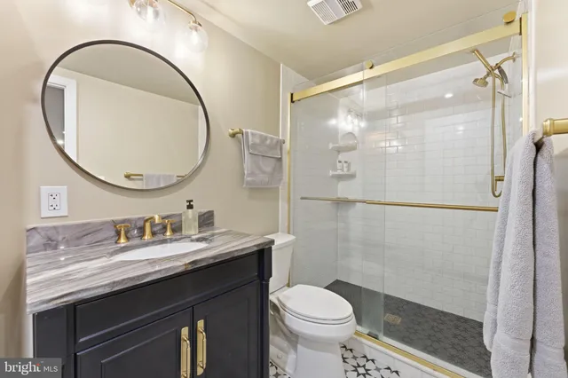 a front view of a multi story building with yard