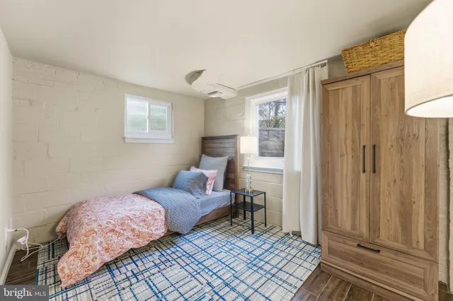 a front view of a building with trees