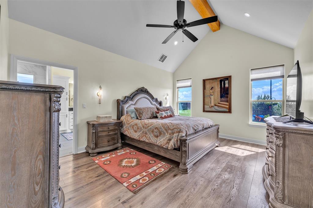 6628 Buffalo Ridge Circle Godley, TX 76044 - Photo 19 of 39 a bedroom with a bed dresser and a window
