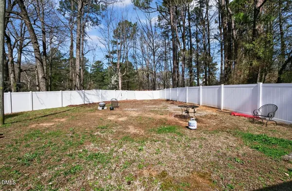 a backyard of apartments with large trees