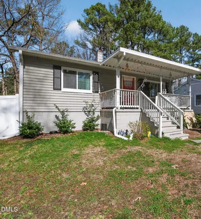 a house that has a tree in front of the house