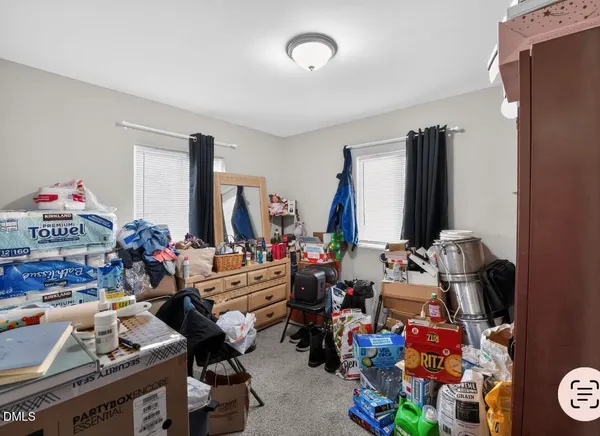 a room with gym equipment and a flat screen tv