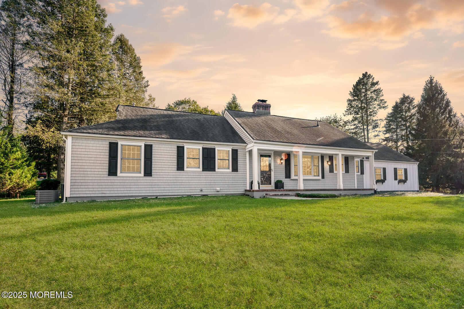 4 Cherry Hill Road Holmdel, NJ 07733 - Photo 1 of 34 a front view of a house with a garden and yard