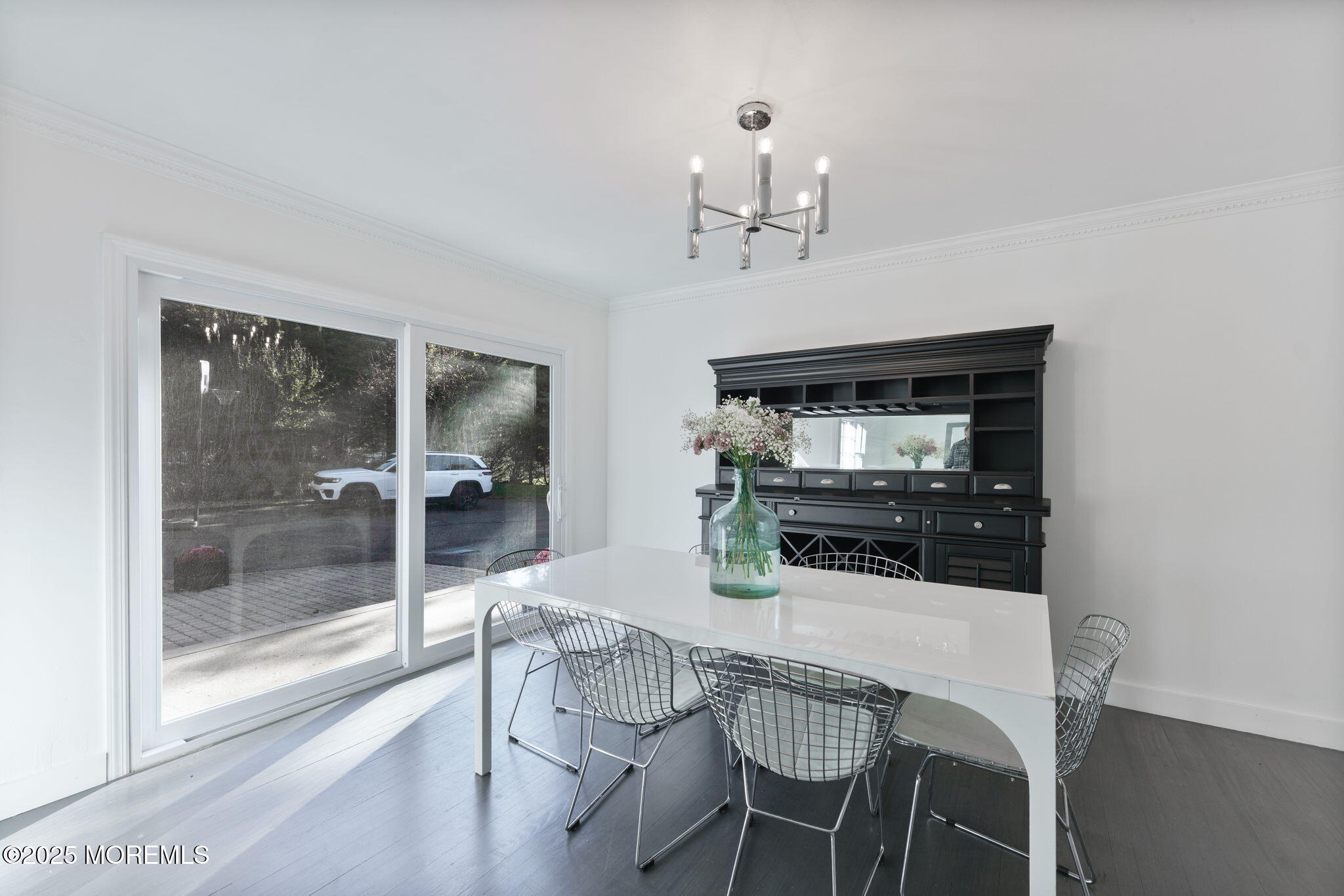 4 Cherry Hill Road Holmdel, NJ 07733 - Photo 11 of 34 a dining room with wooden floor and chandelier