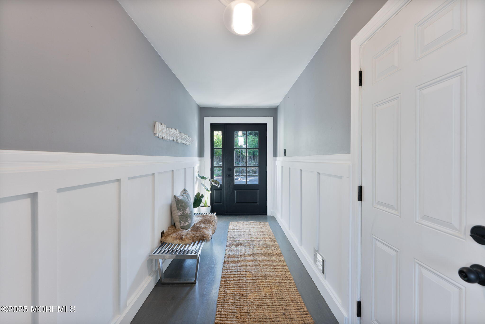 4 Cherry Hill Road Holmdel, NJ 07733 - Photo 13 of 34 a hallway with fireplace and wooden floor