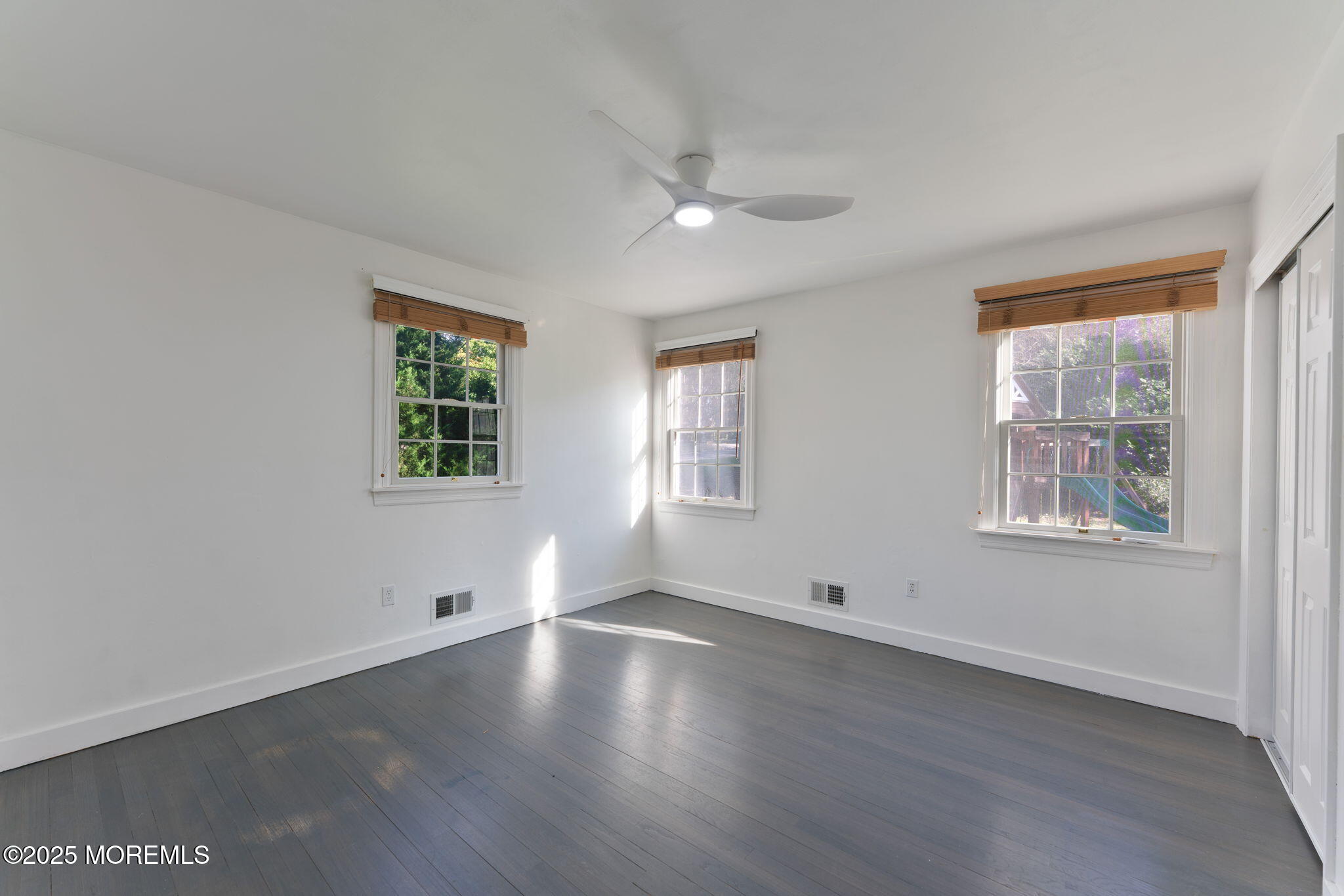 4 Cherry Hill Road Holmdel, NJ 07733 - Photo 17 of 34 a view of wooden floor and windows in a room