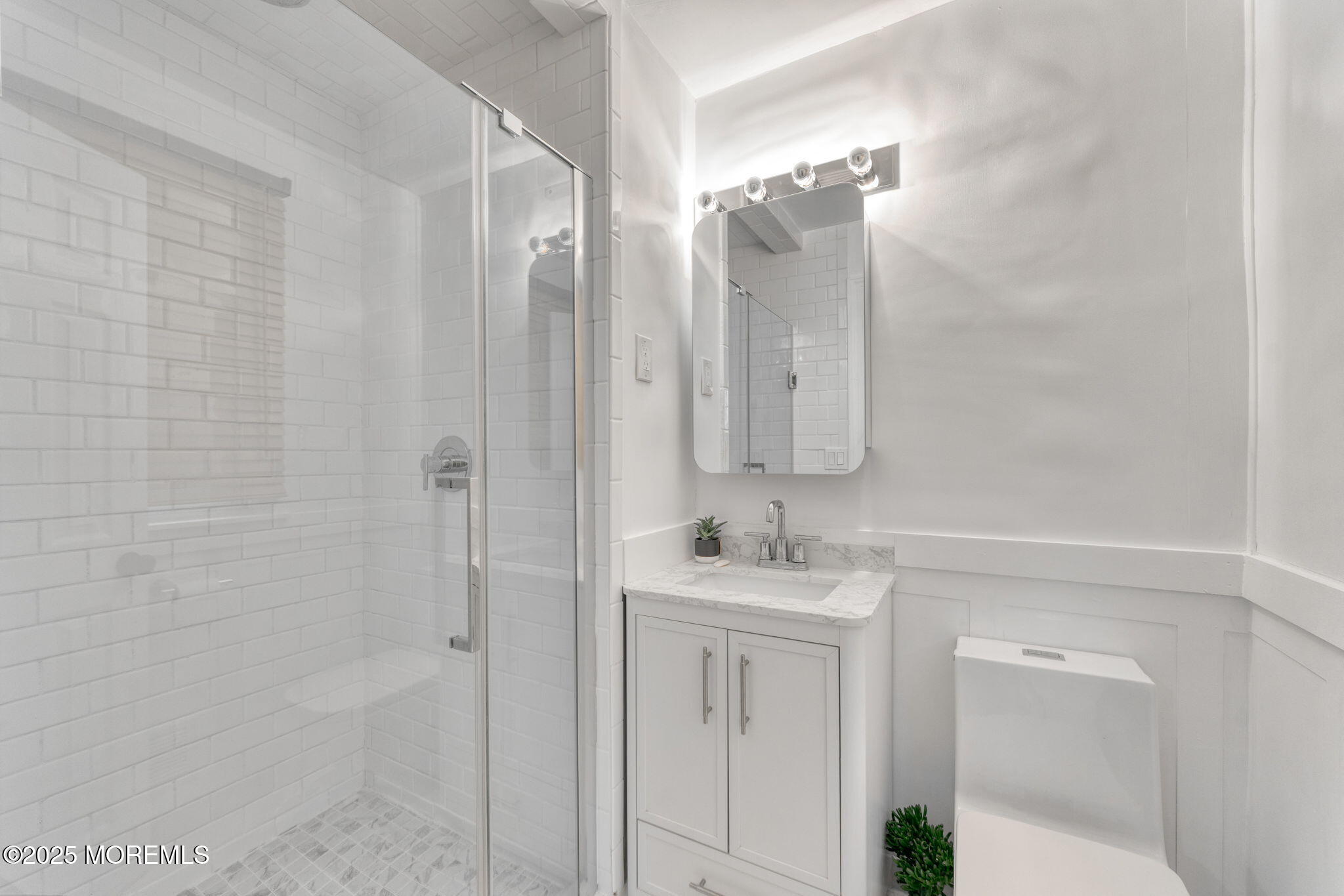 4 Cherry Hill Road Holmdel, NJ 07733 - Photo 20 of 34 a bathroom with a double vanity sink mirror and shower