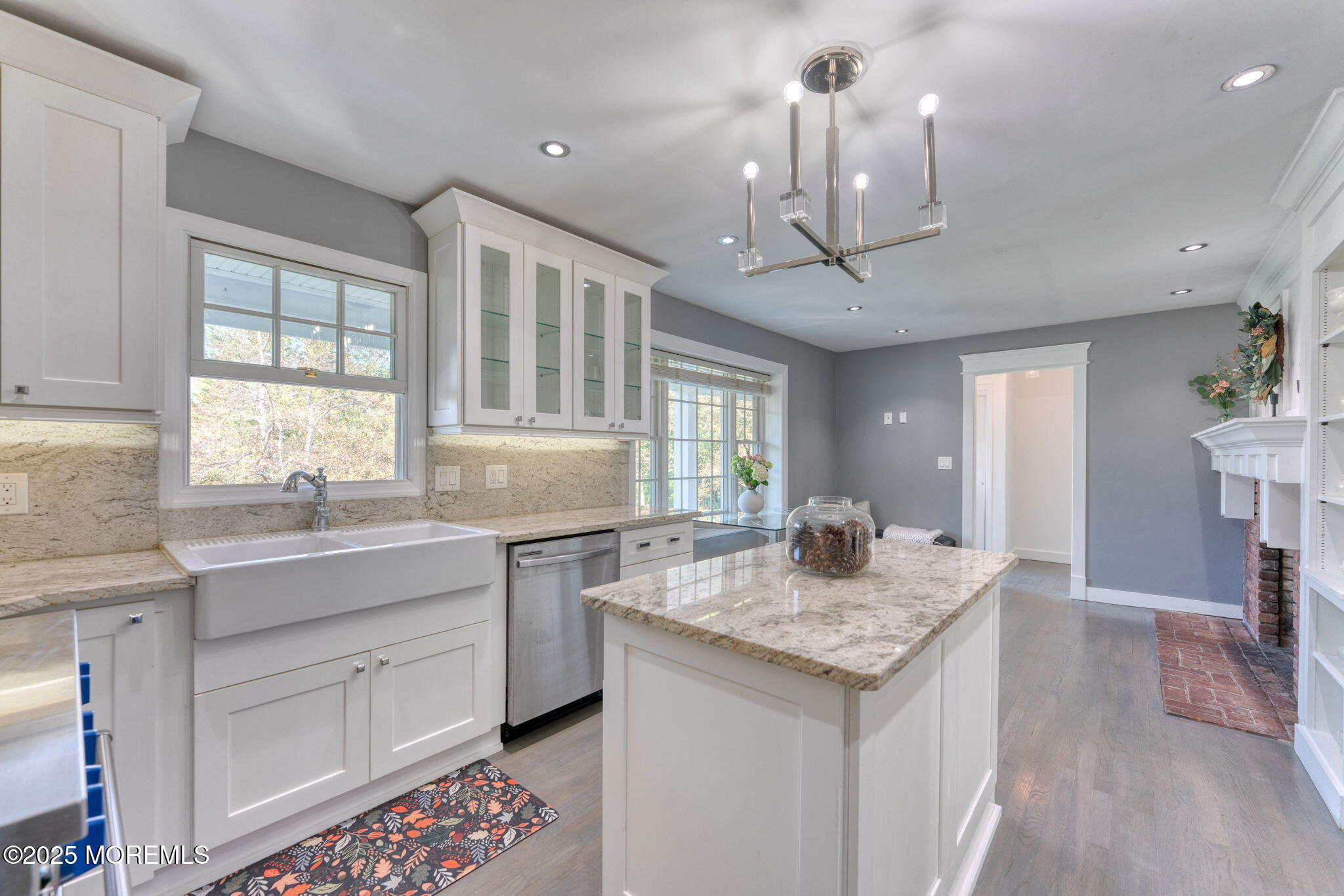 4 Cherry Hill Road Holmdel, NJ 07733 - Photo 4 of 34 a kitchen with granite countertop stove a sink dishwasher a dining table and chairs with wooden floor