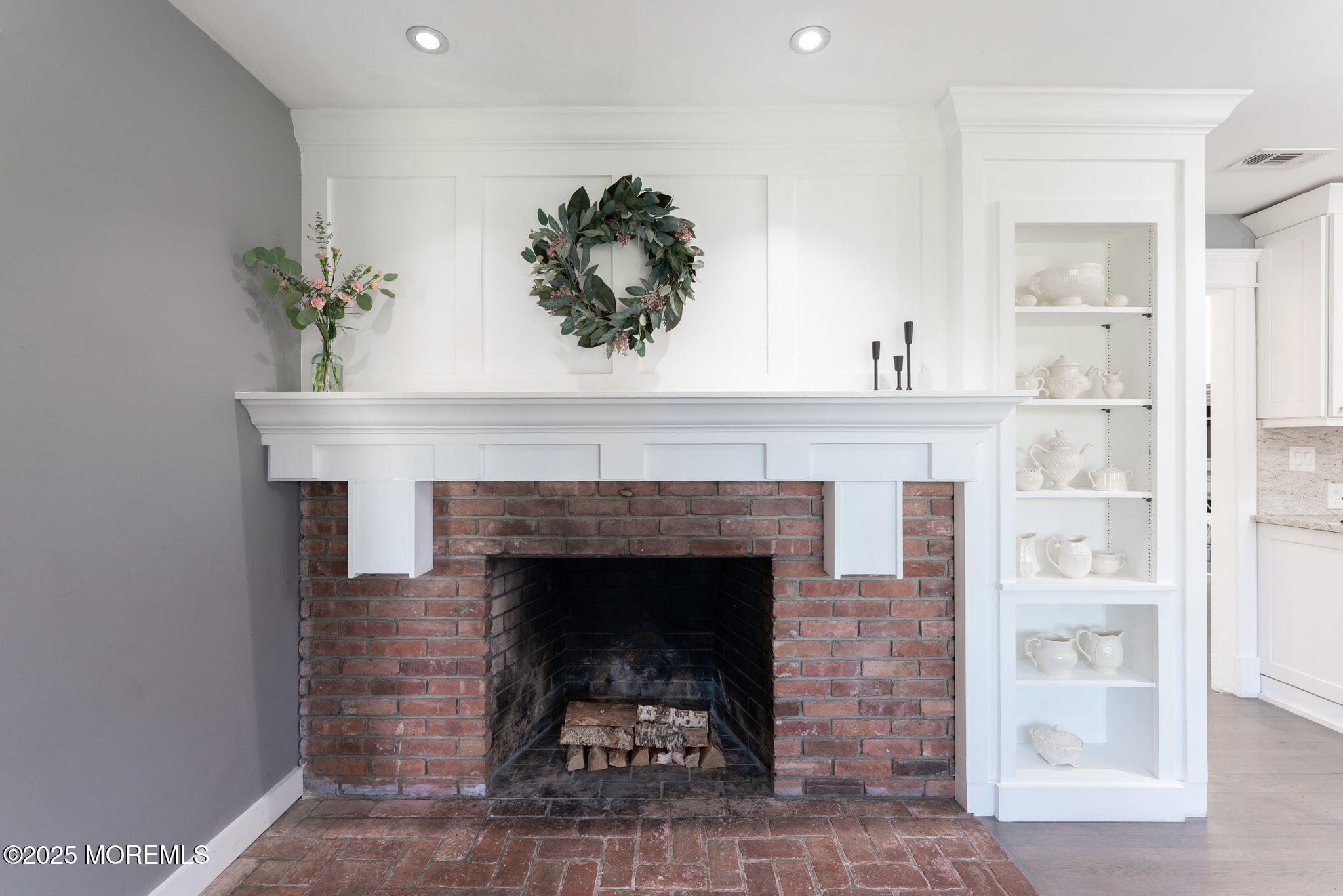 4 Cherry Hill Road Holmdel, NJ 07733 - Photo 9 of 34 a living room with a fireplace and potted plant