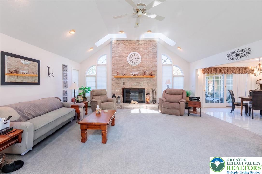 1089 Deemer Road Bath, PA 18014 - Photo 13 of 57 This living area features a grand fireplace and abundant natural light.