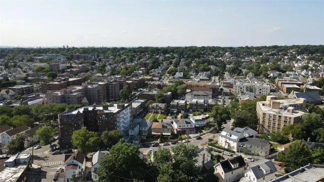 an aerial view of residential houses with outdoor space