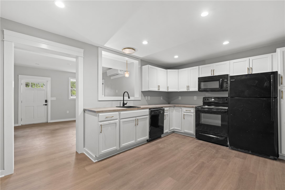 309 Woodland Way Clemson, SC 29631 - Photo 35 of 43 This newly renovated kitchen features sleek appliances and ample counter space, perfect for modern living.
