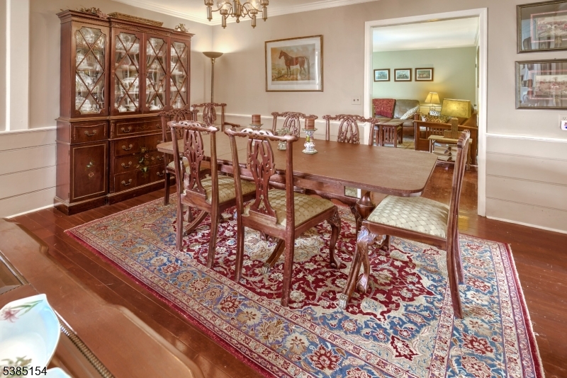 245 Old Turnpike Road Califon, NJ 07830 - Photo 18 of 31 a dining room with furniture a rug and wooden floor