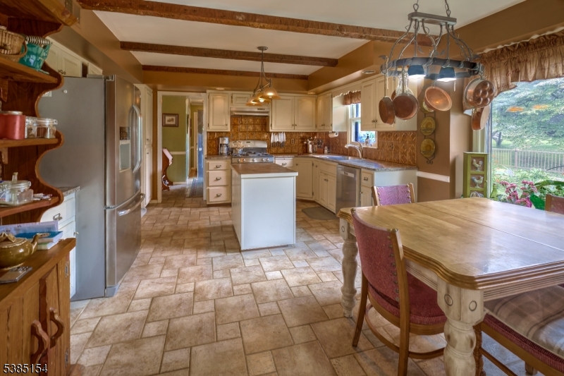 245 Old Turnpike Road Califon, NJ 07830 - Photo 19 of 31 a kitchen with stainless steel appliances granite countertop a sink a counter space and cabinets