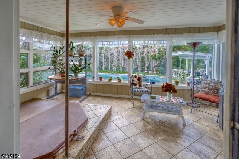 245 Old Turnpike Road Califon, NJ 07830 - Photo 22 of 31 a living room filled with furniture and a potted plant