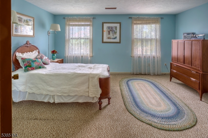 245 Old Turnpike Road Califon, NJ 07830 - Photo 26 of 31 a bedroom with a bed and window
