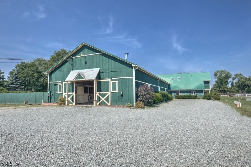 245 Old Turnpike Road Califon, NJ 07830 - Photo 30 of 31 a front view of a house with a yard and garage
